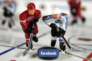 Toy Hockeymen and Facebook on the puck